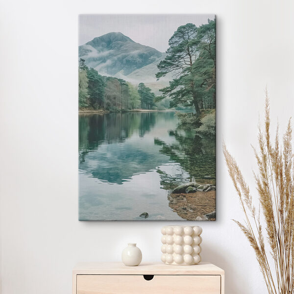 A lake surrounded by trees and mountains A lake surrounded by trees and mountains