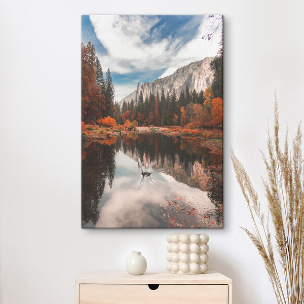 A lake surrounded by trees and mountains A lake surrounded by trees and mountains