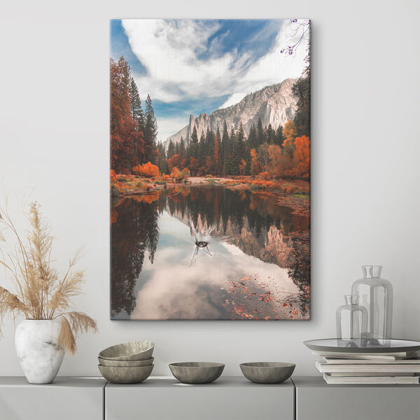 A lake surrounded by trees and mountains A lake surrounded by trees and mountains