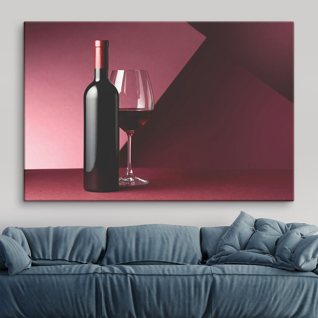 A bottle of wine next to a glass of wine