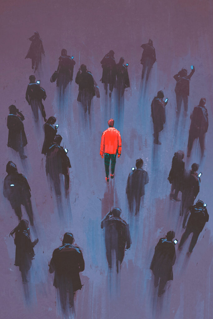 A man standing in a crowd of people A man standing in a crowd of people