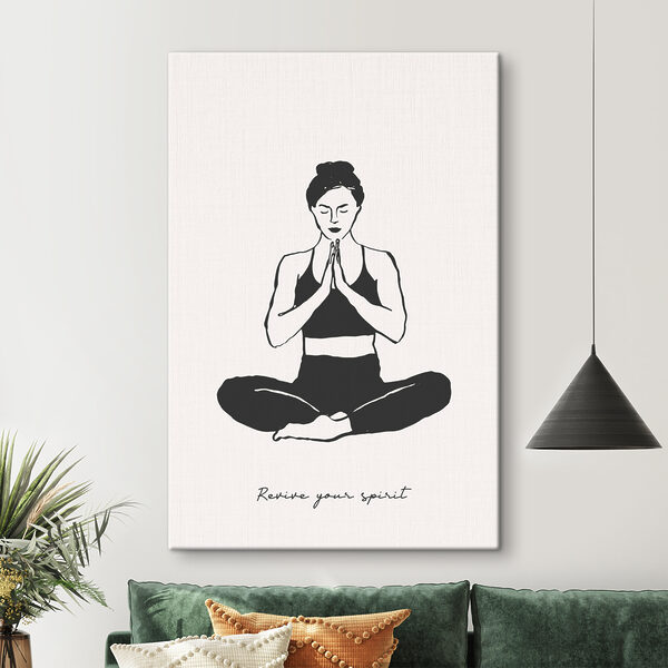 A woman sitting cross legged with her hands together A woman sitting cross legged with her hands together