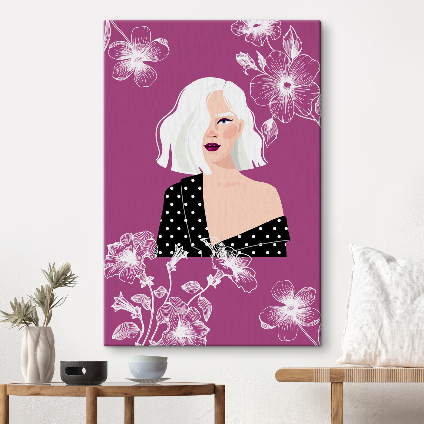 A woman with white hair and polka dot shirt