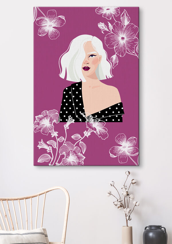 A woman with white hair and polka dot shirt