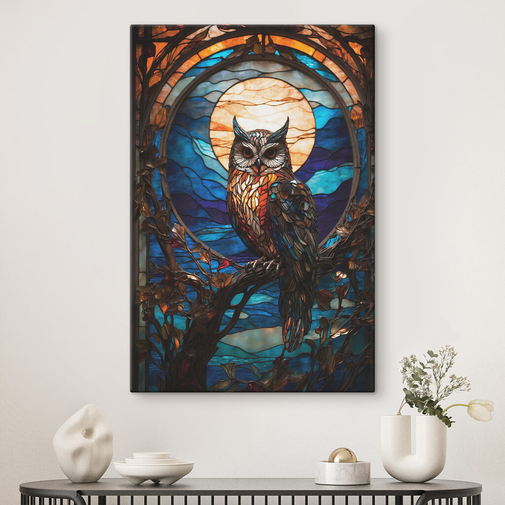 A stained glass owl on a tree branch A stained glass owl on a tree branch