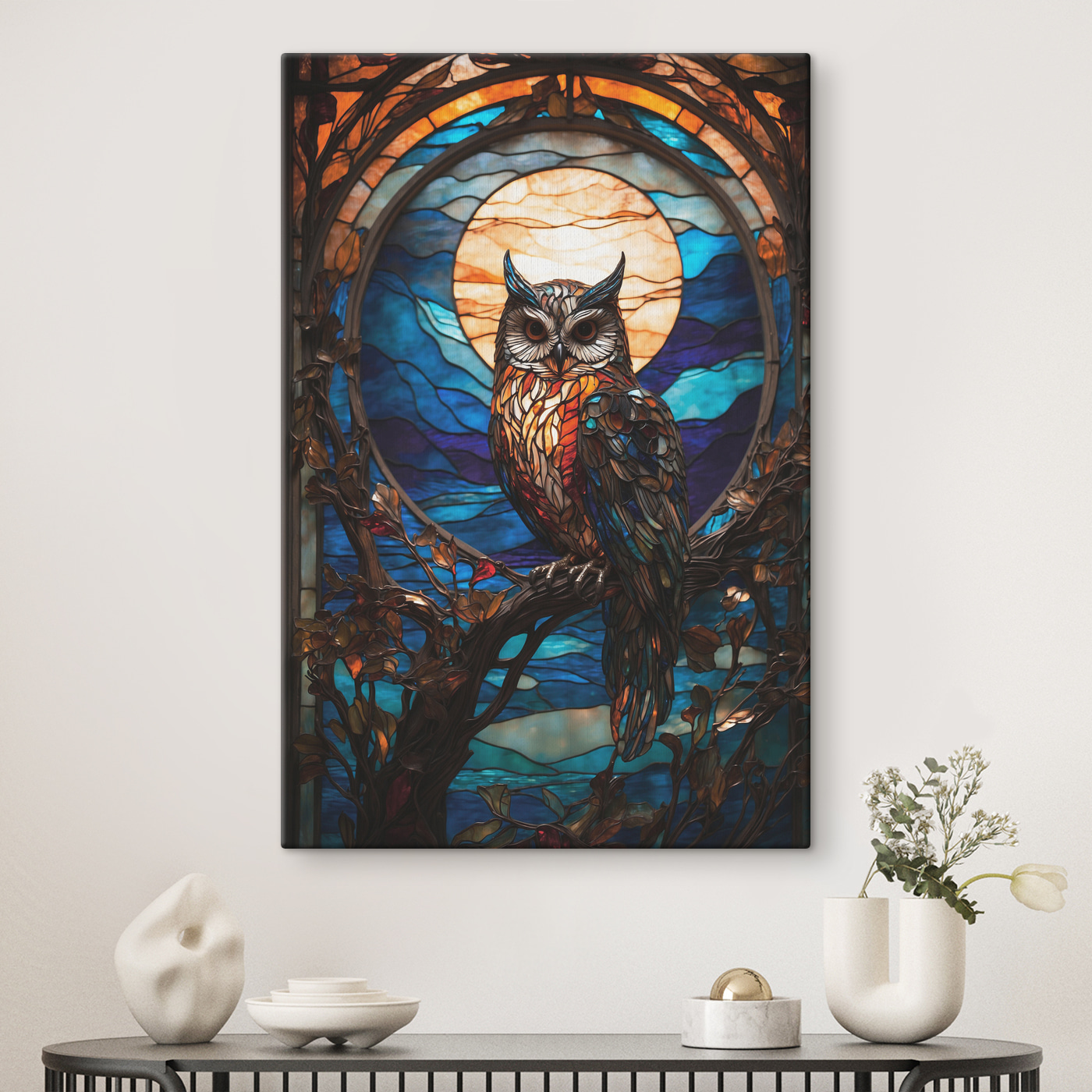 A stained glass owl on a tree branch A stained glass owl on a tree branch