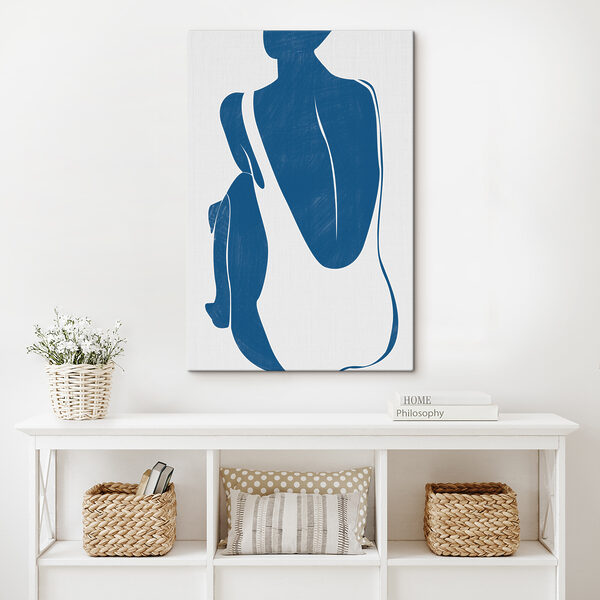 A blue and white silhouette of a woman and a penguin