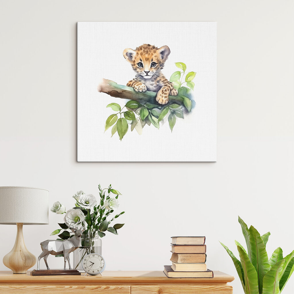 A watercolor of a baby leopard on a tree branch