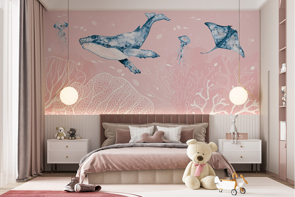 A whale and stingrays swimming in the ocean