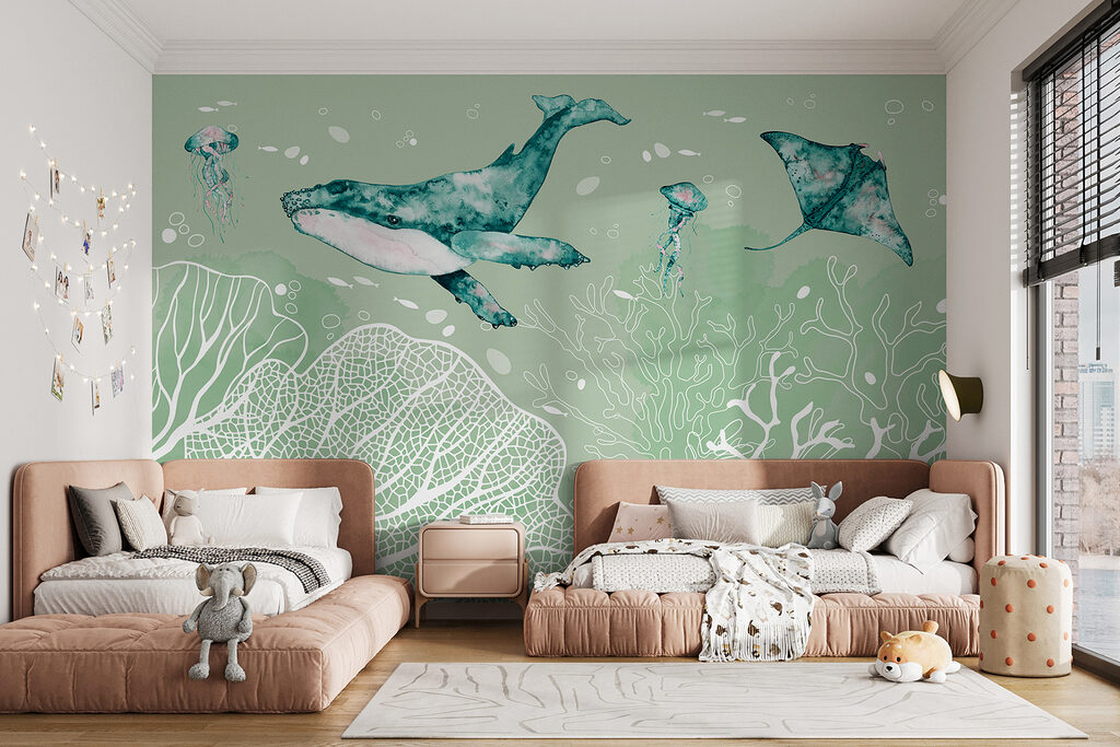 A whale and stingrays swimming in the ocean