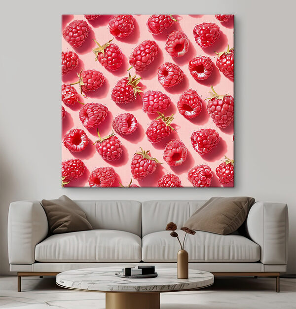 A group of raspberries on a pink surface
