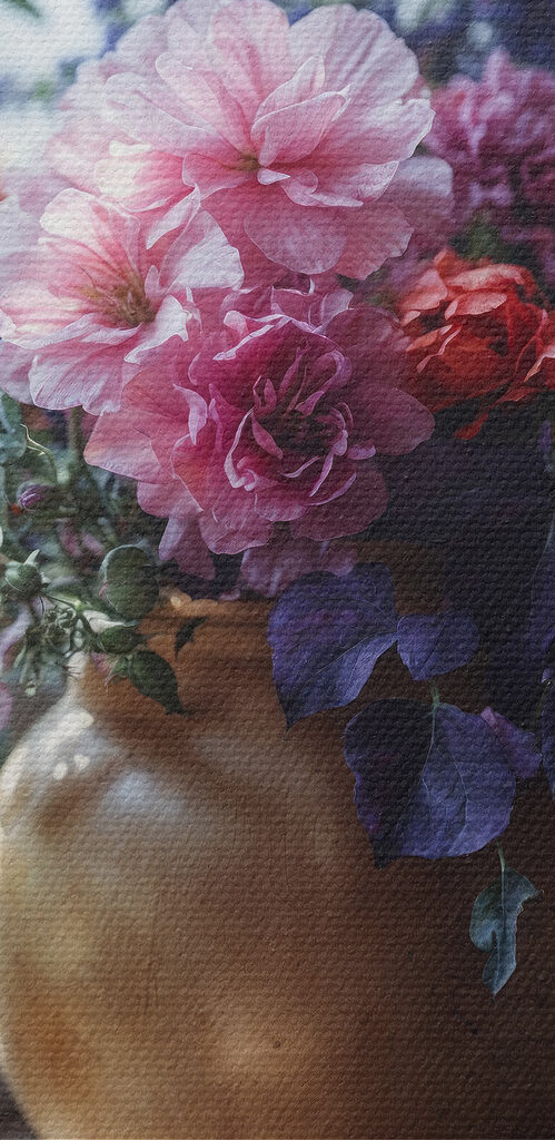 A vase of flowers on a window sill