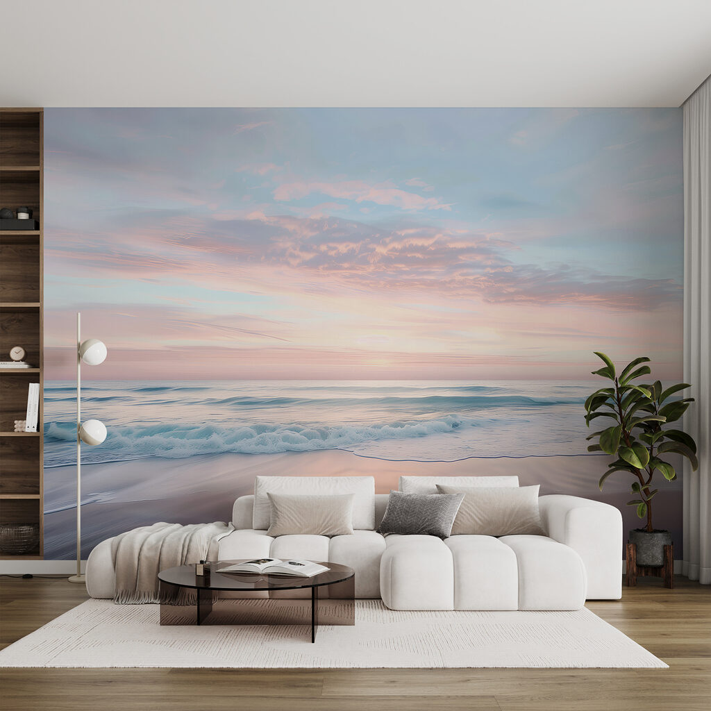 A beach with waves and a pink sky
