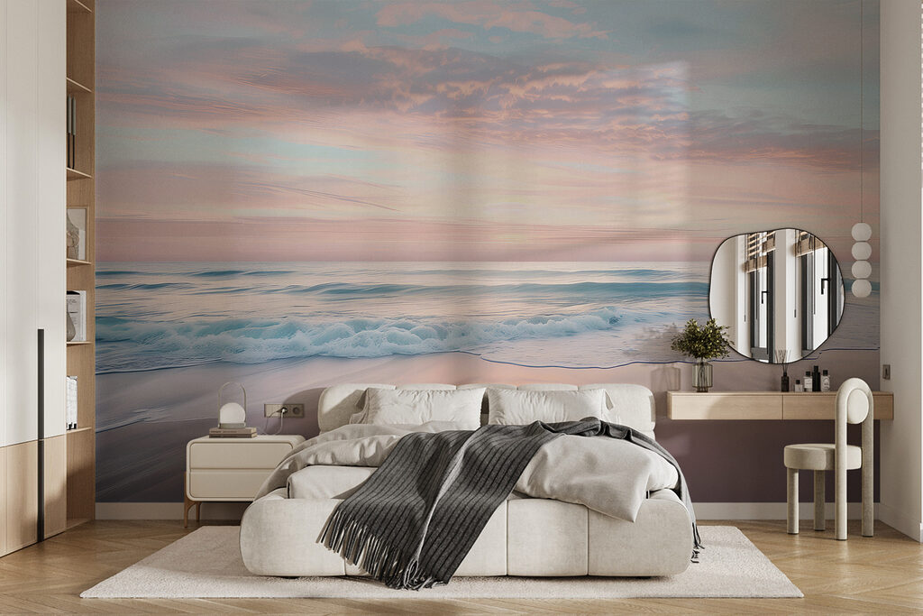 A beach with waves and a pink sky