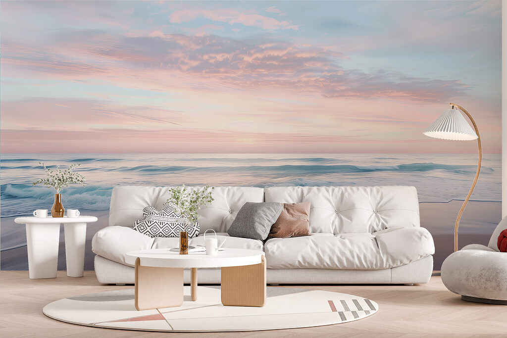 A beach with waves and a pink sky