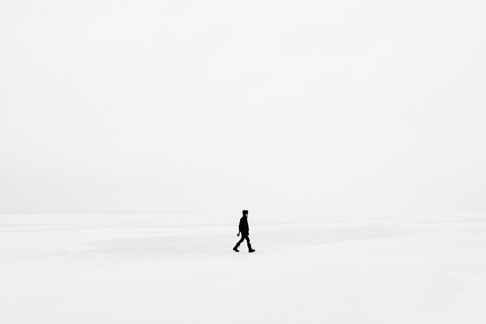 Person walking in the snow Person walking in the snow