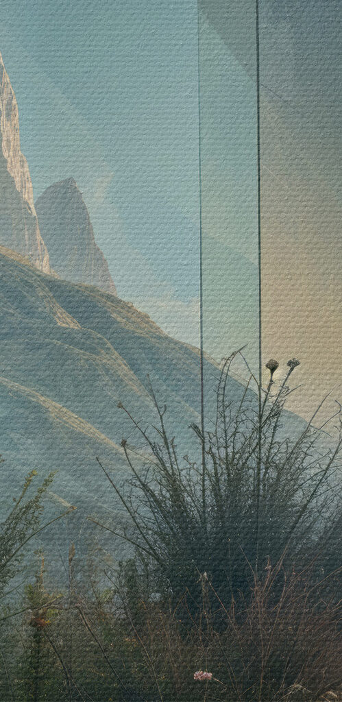 Building with a view of mountains and grass