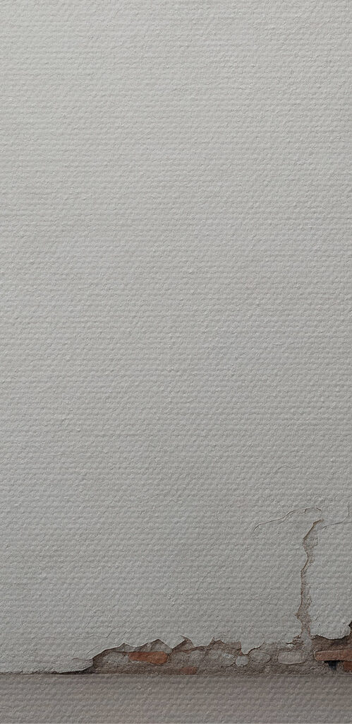 White wall with a crack in the wall White wall with a crack in the wall