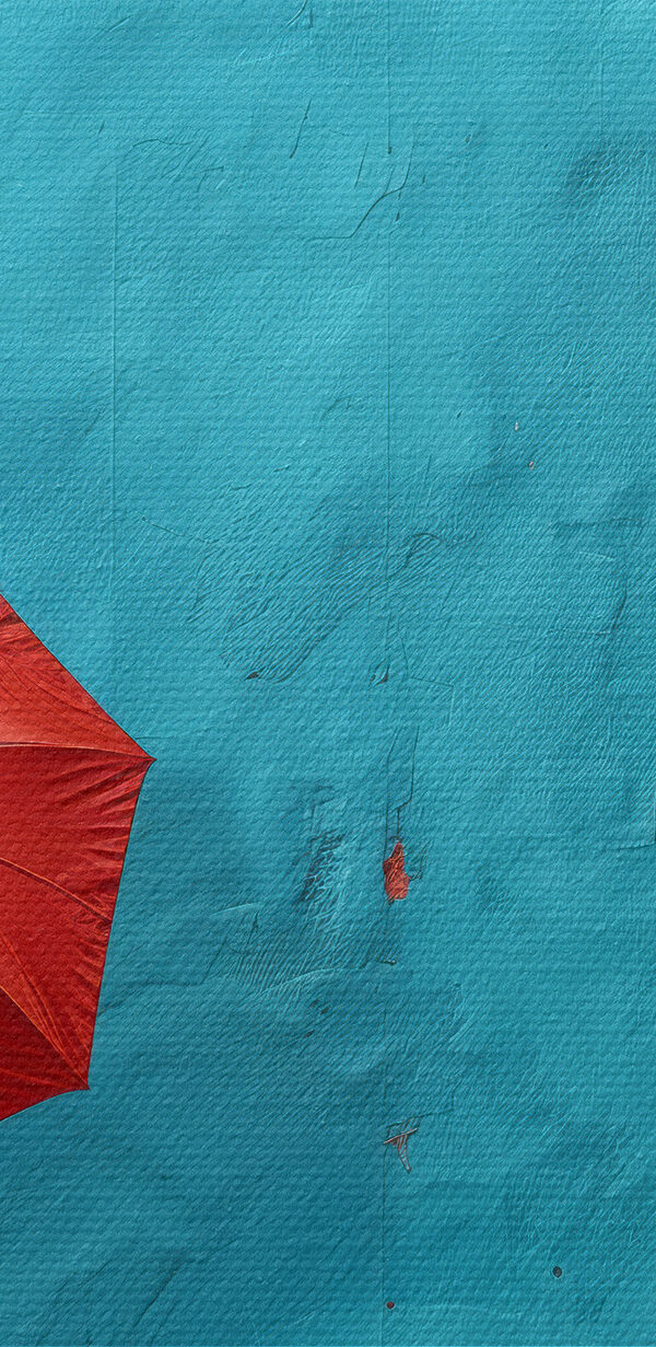 Person holding a red umbrella Person holding a red umbrella