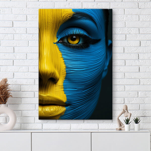Close up of a woman's face painted with a yellow and blue paint Close up of a woman's face painted with a yellow and blue paint