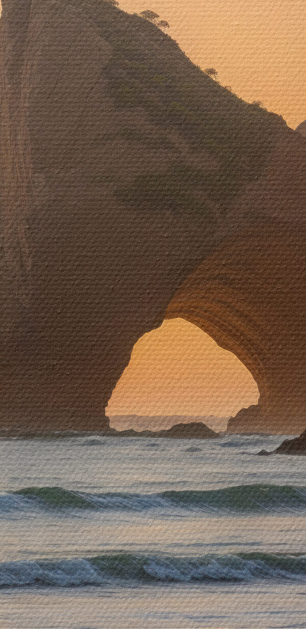 Sunset over a beach with rocks and water Sunset over a beach with rocks and water