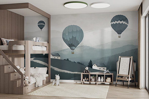 Group of hot air balloons flying over a village