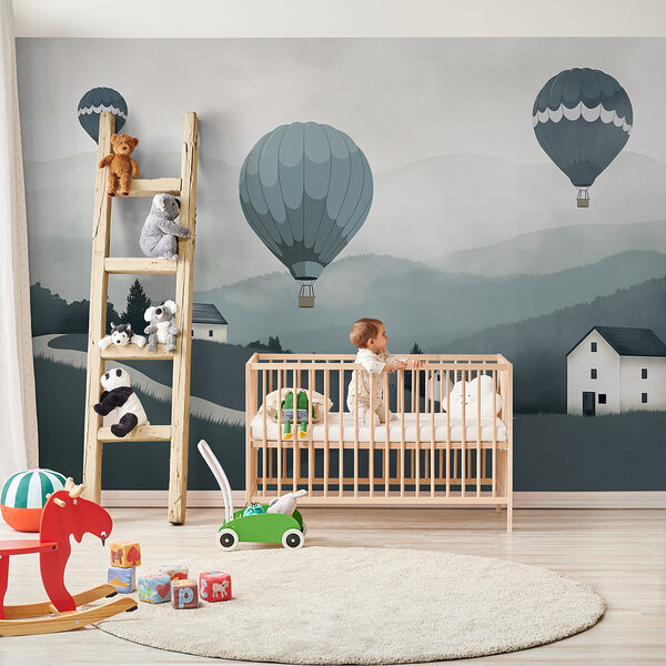 Group of hot air balloons flying over a village
