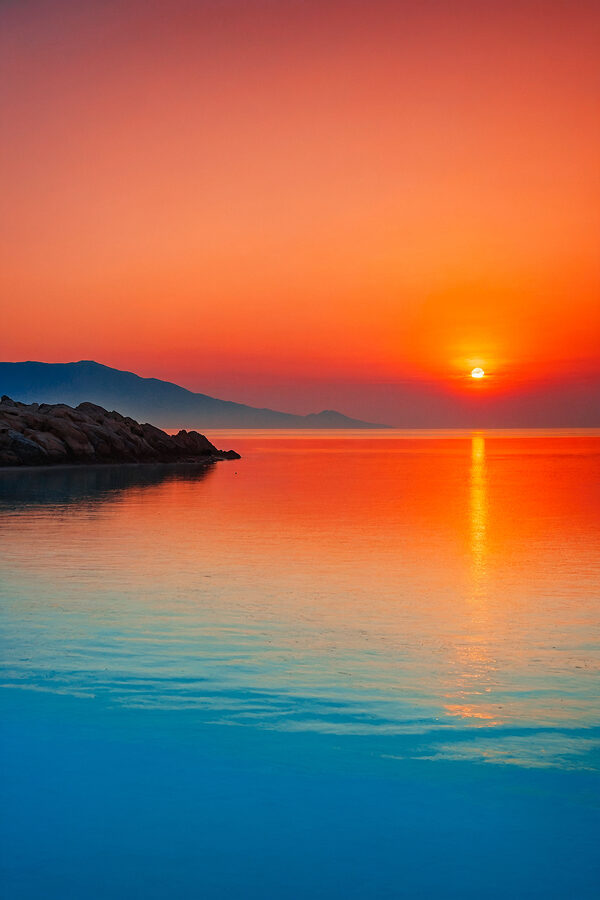 Sunset over a body of water Sunset over a body of water