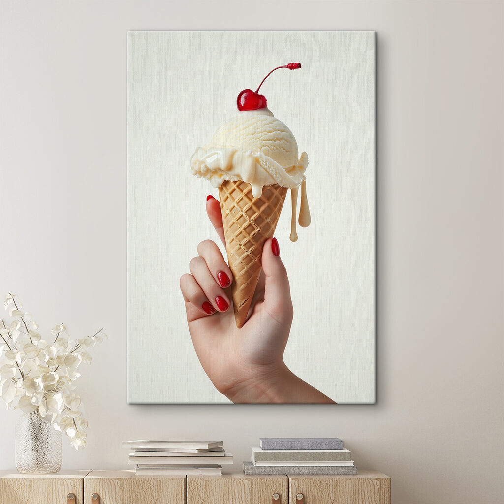 Hand holding an ice cream cone with a cherry on top