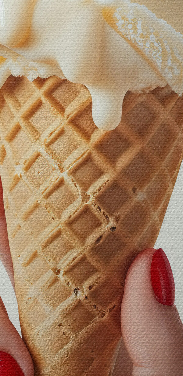 Hand holding an ice cream cone with a cherry on top