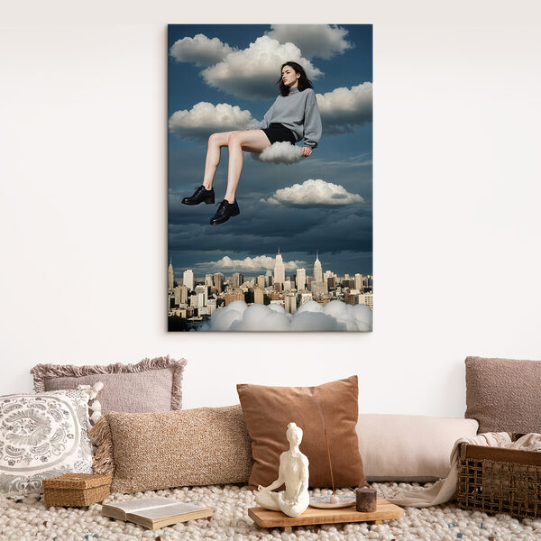 Woman sitting on a cloud in the sky Woman sitting on a cloud in the sky