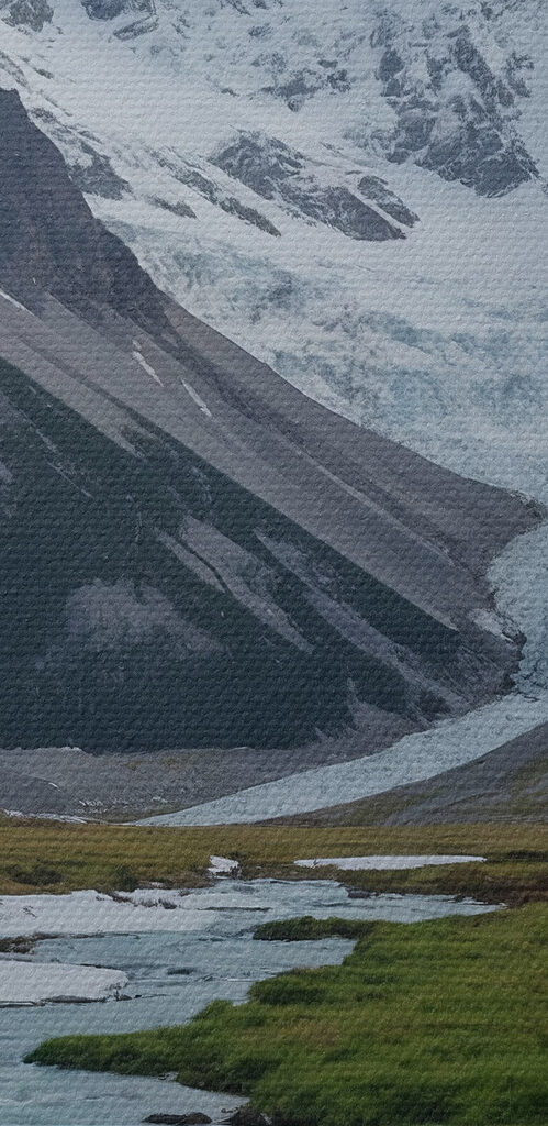 River running through a valley with snow covered mountains River running through a valley with snow covered mountains