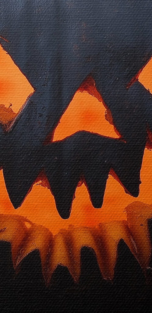 Carved pumpkin on a book Carved pumpkin on a book