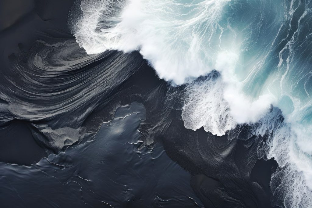 Waves crashing waves on a black sand beach