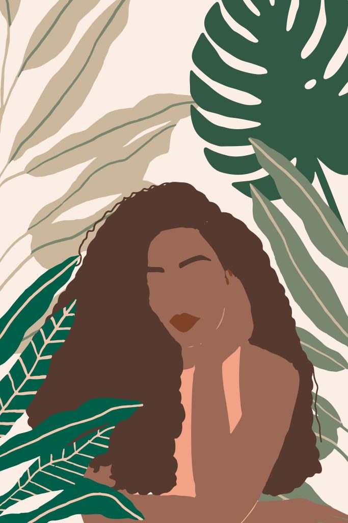 Woman with long hair and a green leafy background