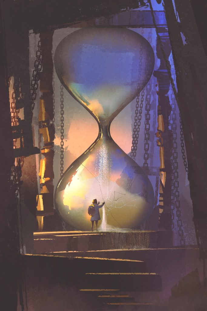 Person standing in a large hourglass Person standing in a large hourglass