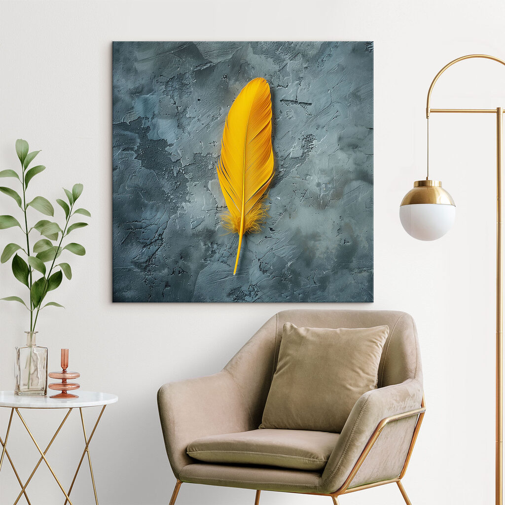 Yellow feather on a grey surface