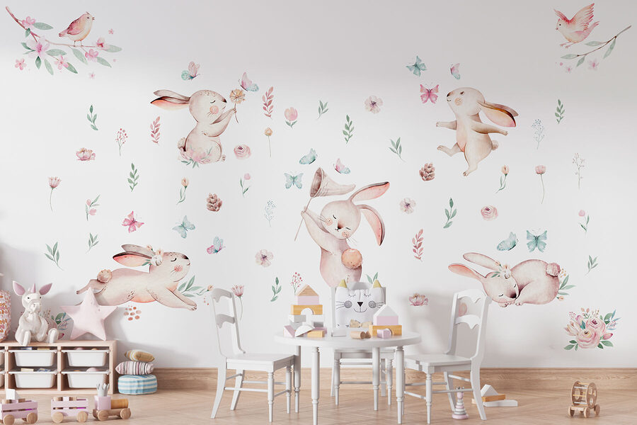 Gruppo di conigli con fiori e farfalle