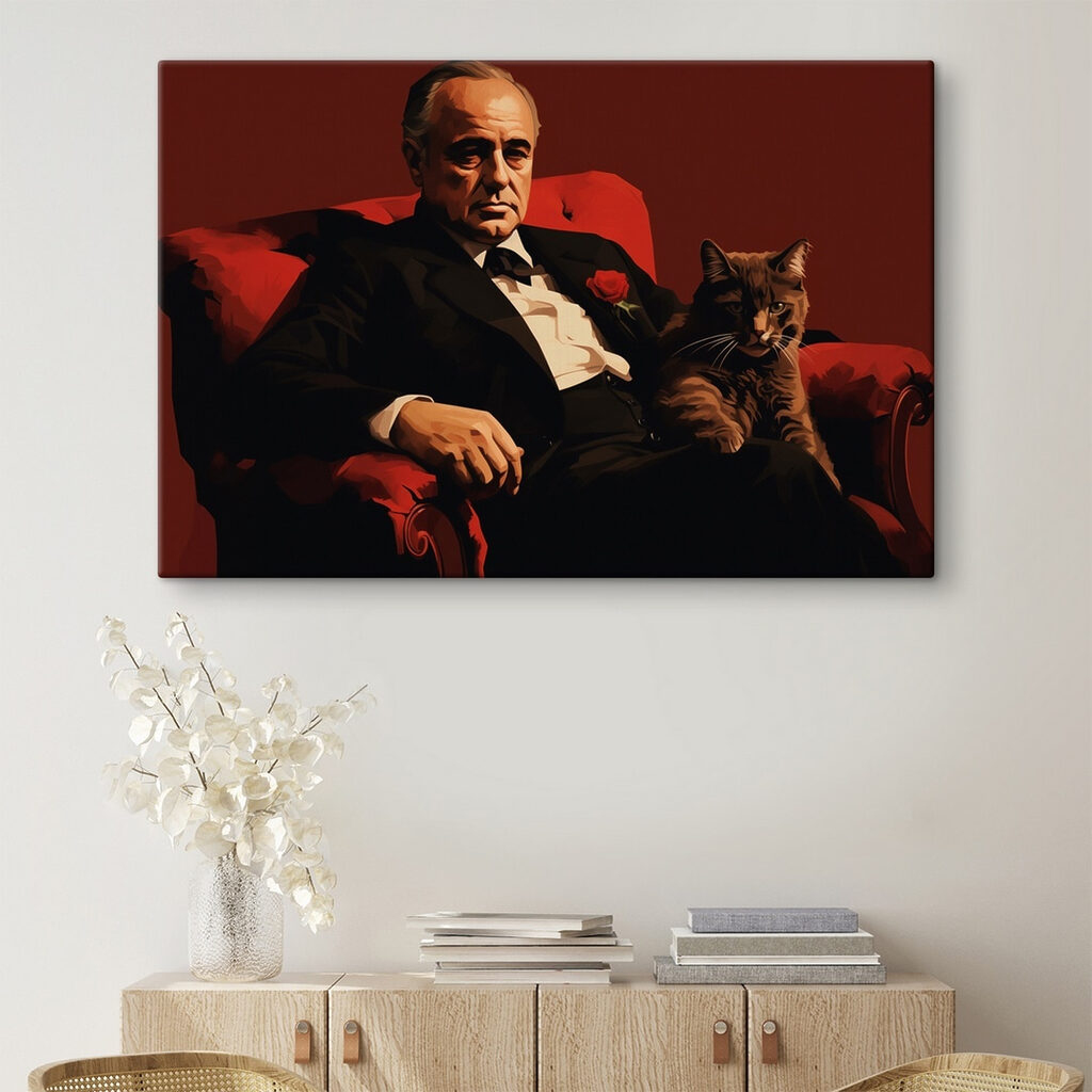 Man in a suit and tie sitting in a chair with a cat