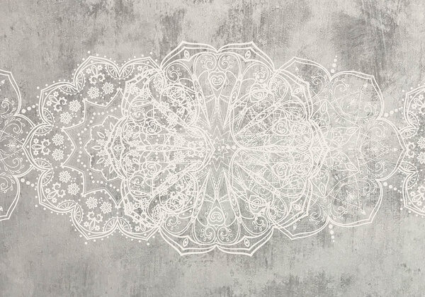 Disegno ornamentale bianco su superficie grigia Disegno ornamentale bianco su superficie grigia