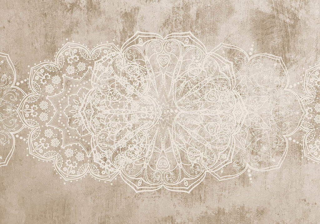 Disegno ornato bianco su superficie marrone Disegno ornato bianco su superficie marrone