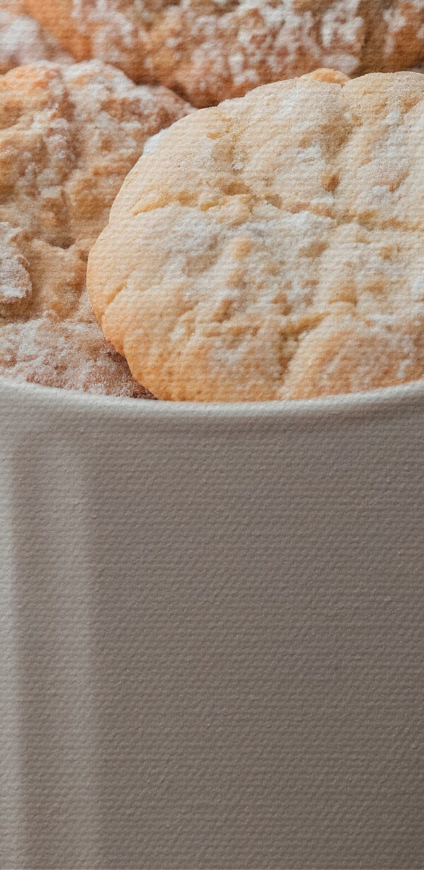 Cup of cookies with powdered sugar