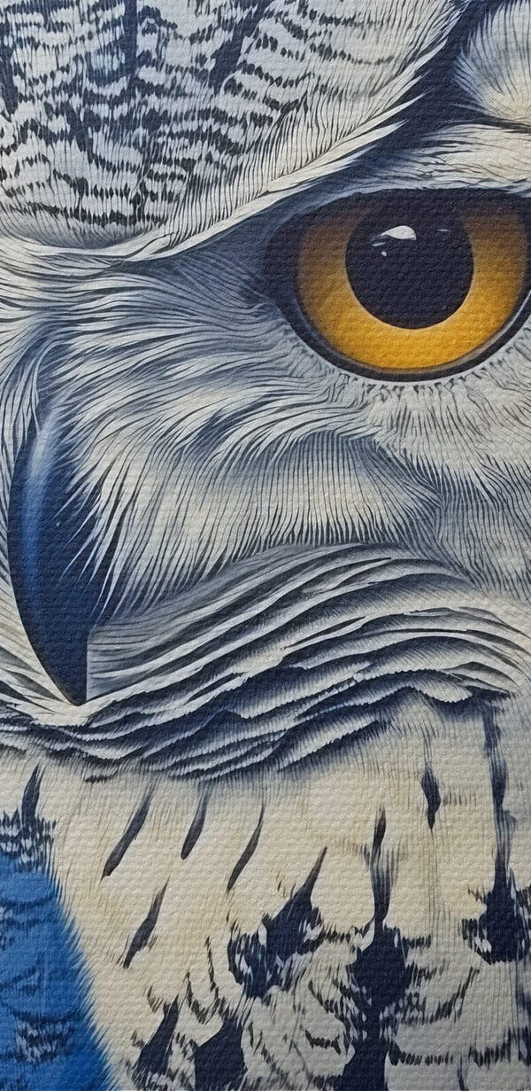 An owl with yellow eyes An owl with yellow eyes