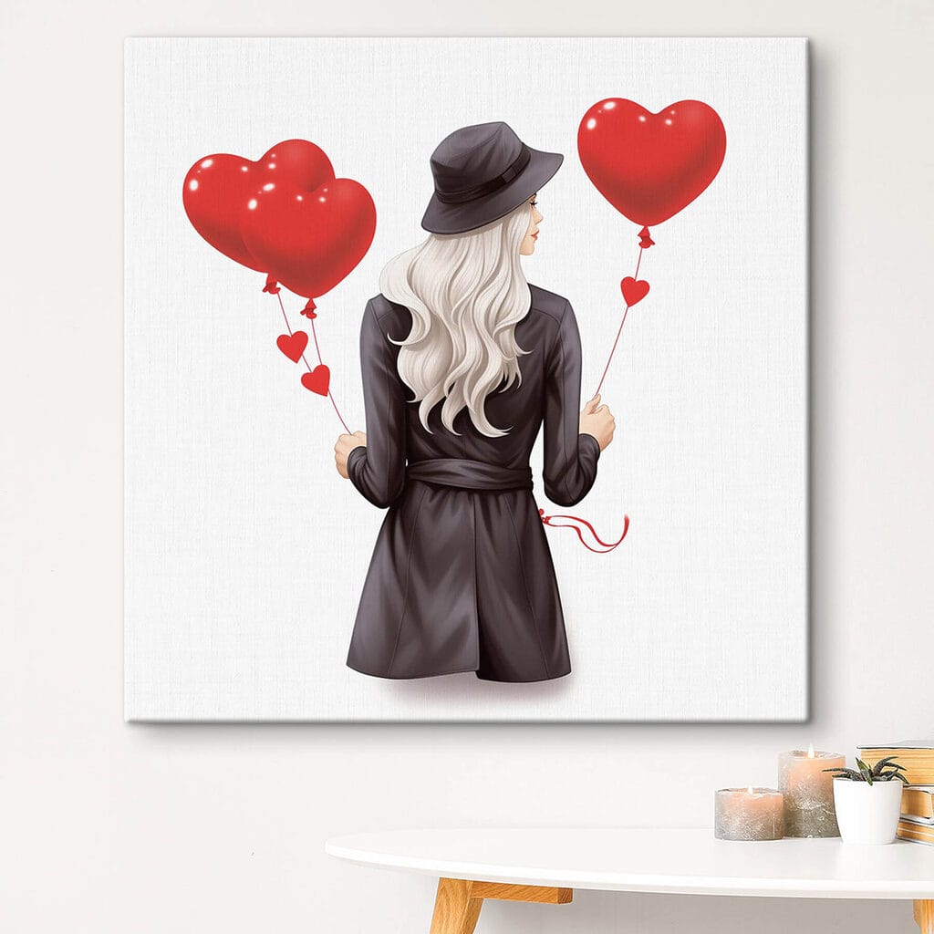 Woman holding a heart shaped balloon Woman holding a heart shaped balloon