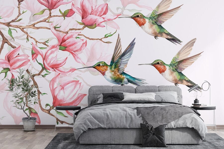 Gruppo di colibrì in volo accanto ai fiori