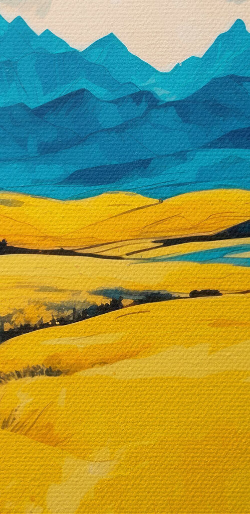 Yellow field with mountains in the background Yellow field with mountains in the background