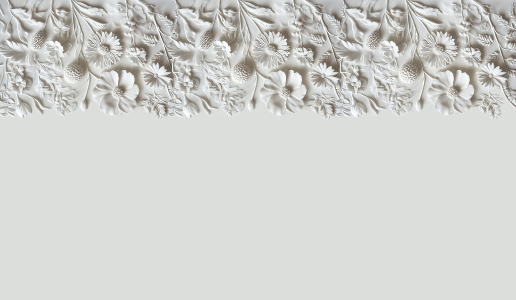 Disegno floreale bianco su una parete Disegno floreale bianco su una parete