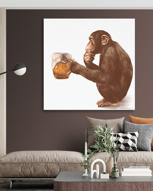 Monkey holding a mug of beer