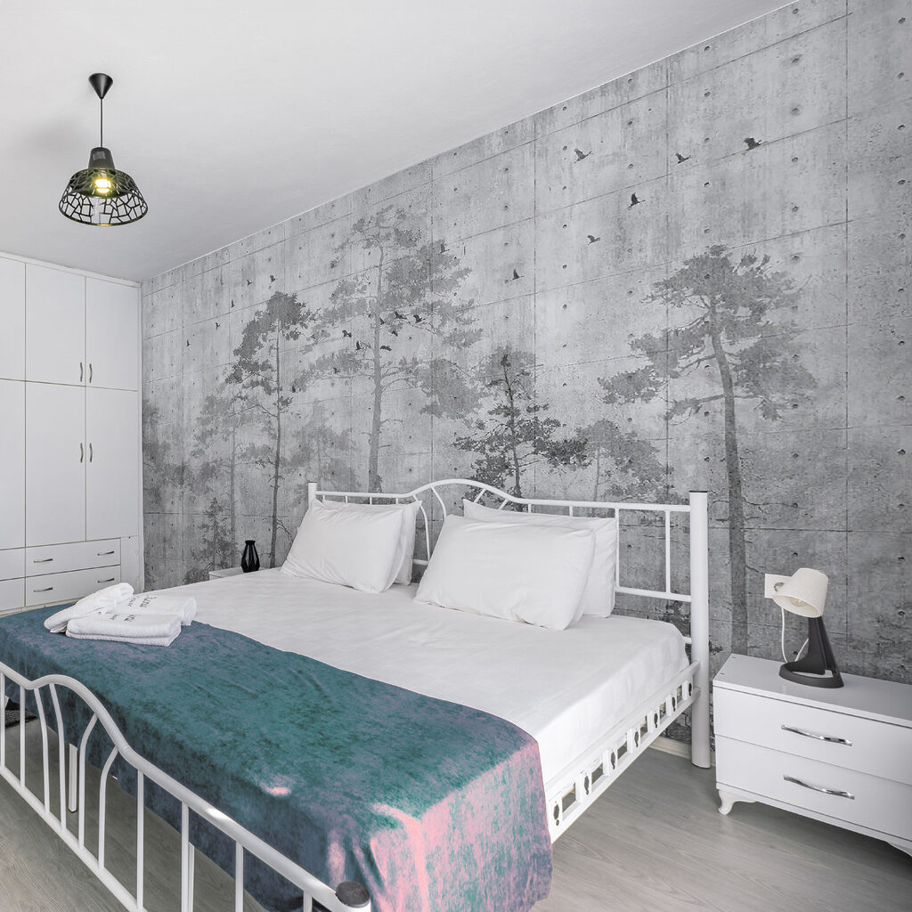 Grey wall with trees and birds