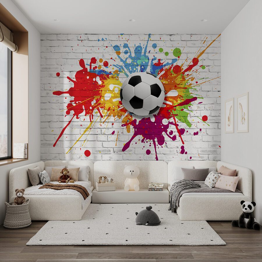 Pallone da calcio su un muro di mattoni